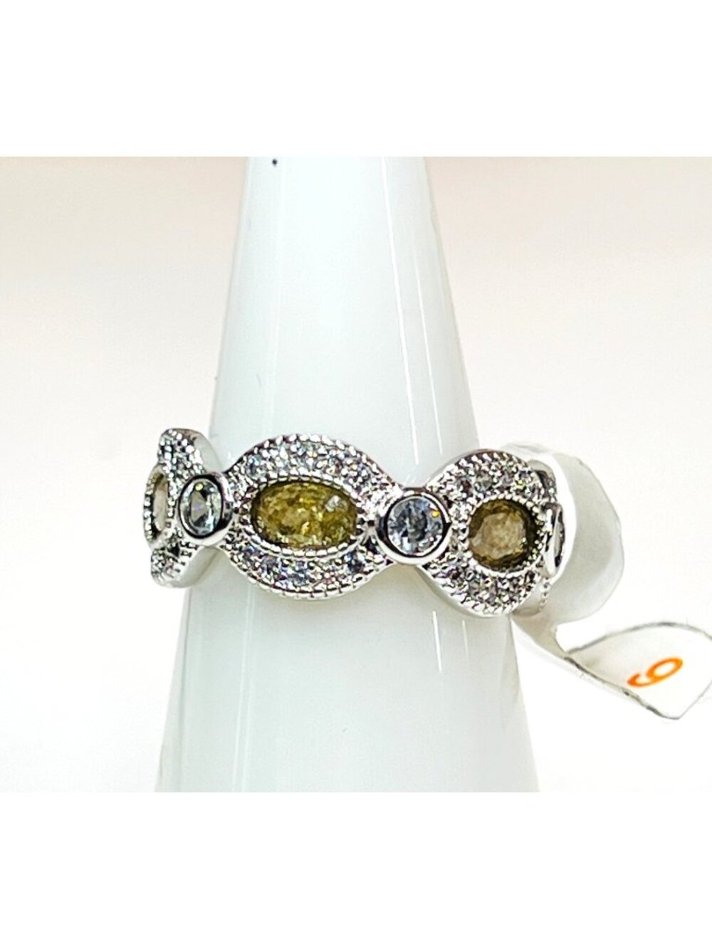 Ring Bomb Party Ring, NWOT, size 6, topaz color stones, wide silver color band